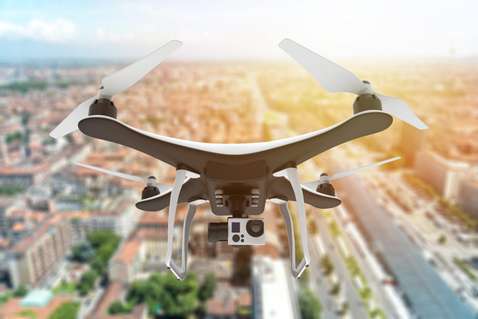 A camera flying over the city with buildings in the background.