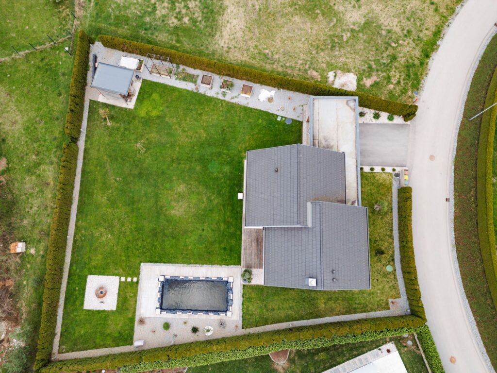 A bird 's eye view of a house with pool and garden.